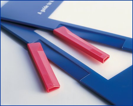 plastic clamp grips the paper