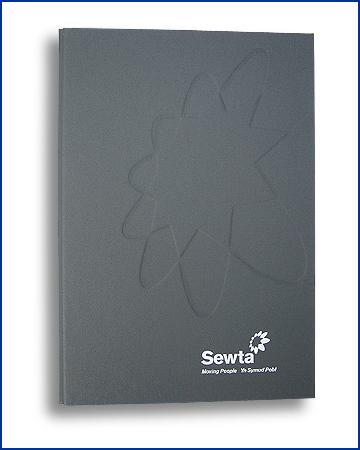 composite, buckram black debossed folder and bnder