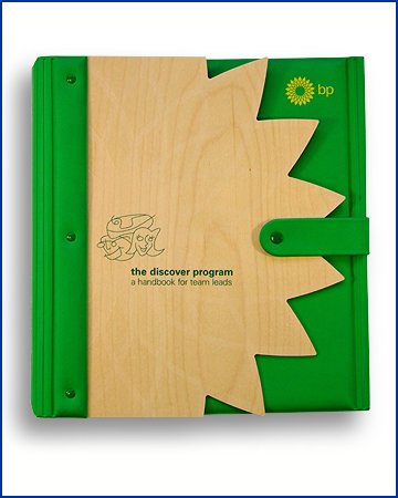wood and rubber folder, the wood is shaped and varnished the rubber is green