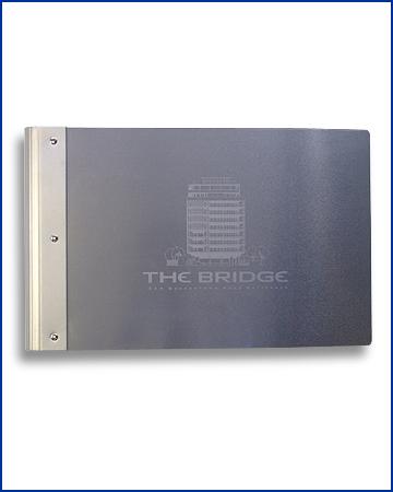 Home pack for theBridge, screen printed on metal with curved card spine