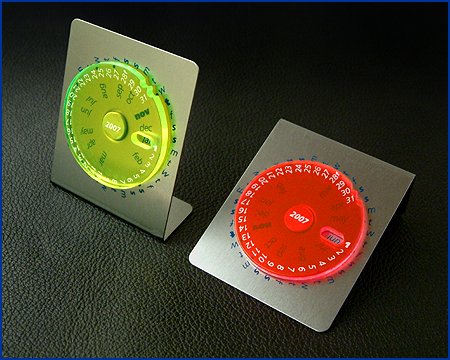 standing liteyear metal and edgelit perspex calendars in fluro green and flame red