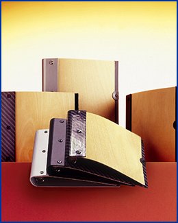 selection of wooden binders wallets and folders, bound with metal and paper over board