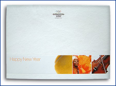 closeup olympic symbol on box folder, in metal and paper over board