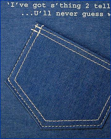 close up of blue jean material on ring binder